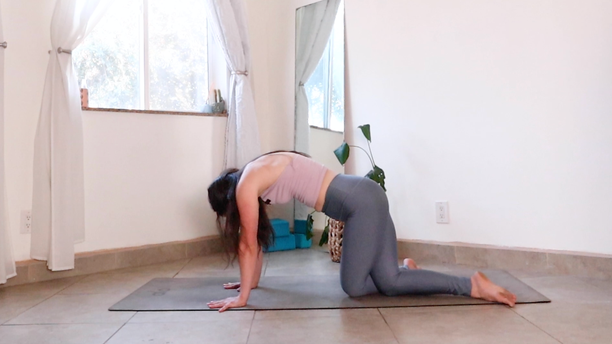 Teacher Daria LeGrand in Cat-Cow Tilt, part of her morning yoga for creative energy